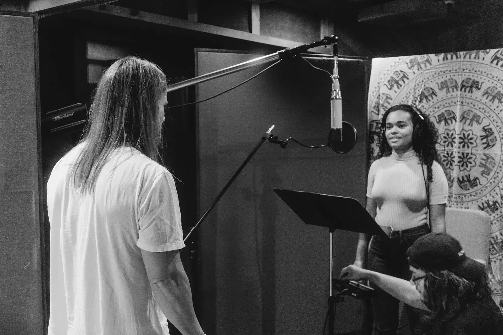 Max Martin coaching vocals in a recording studio